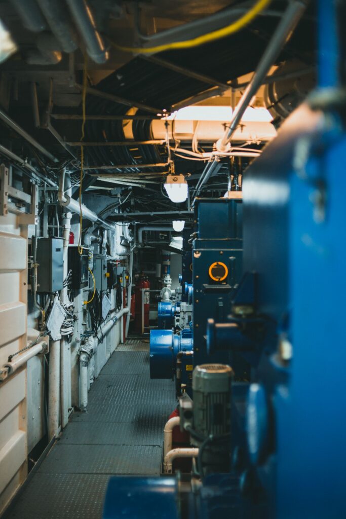 A mechanical room with pumps and pipework