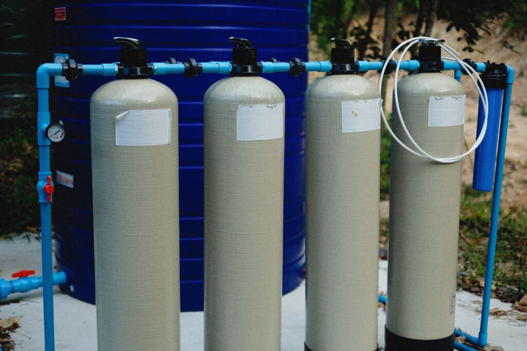 Water treatment tanks connected by blue supply pipework